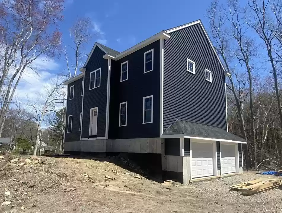 A newly-built Three-Storey 4 Bedroom House with 2.5 Bathrooms and 2 Attached Garages, Gross Floor Area 2400 sqft - on 111 Dunbar Street, Taunton, Massachussets - Price $675,000